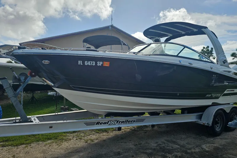 Slide: The Image of 2020 Monterey 275SS Super Sport boat on trailer, parked outdoors under cloudy sky. - 7