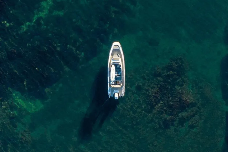 Slide: The Image of Aerial view of 2025 Nimbus T9 boat on clear turquoise water. - 17