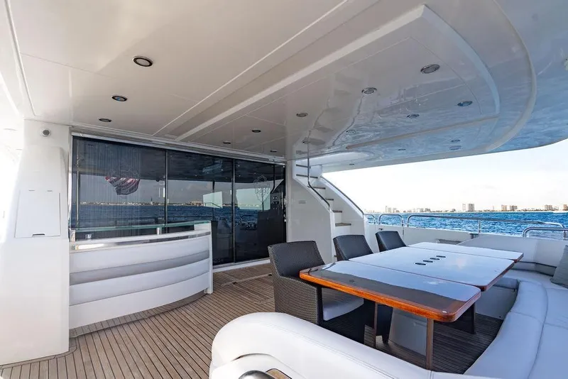 Slide: The Image of Luxurious 2010 Princess 95 Motor Yacht deck with seating and ocean view. - 106
