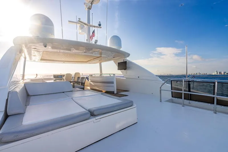 Slide: The Image of Luxurious 2010 Princess 95 Motor Yacht deck with sun loungers and ocean view. - 116