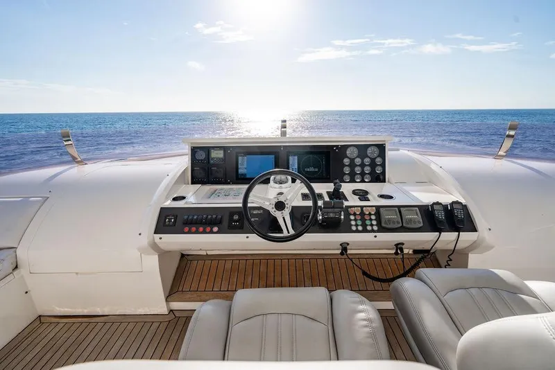 Slide: The Image of Helm of 2010 Princess 95 Motor Yacht with ocean view and modern controls. - 121