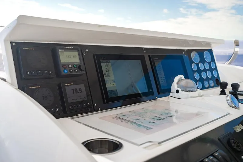 Slide: The Image of Control panel of a 2010 Princess 95 Motor Yacht with navigation instruments. - 123