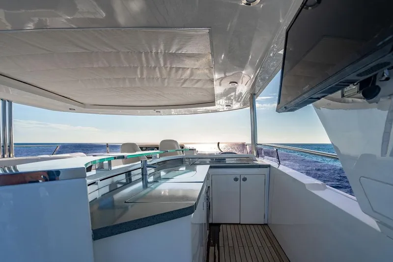 Slide: The Image of Luxurious 2010 Princess 95 Motor Yacht deck with ocean view and modern amenities. - 129