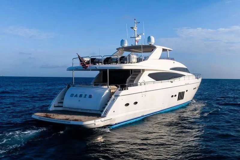 Slide: The Image of 2010 Princess 95 Motor Yacht cruising on open sea under clear blue sky. - 13