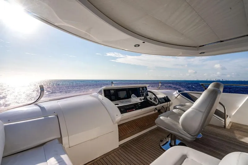 Slide: The Image of Luxurious 2010 Princess 95 Motor Yacht helm with ocean view and modern controls. - 136