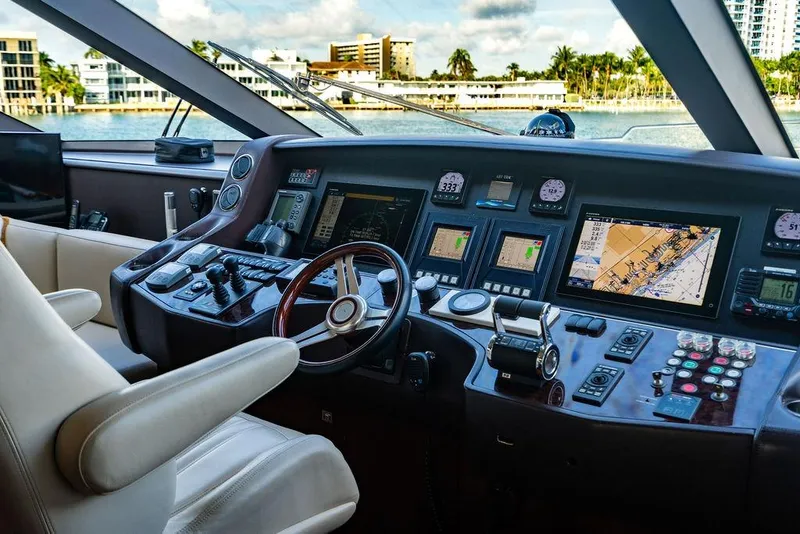 Slide: The Image of Luxurious 2010 Princess 95 Motor Yacht cockpit with advanced navigation systems and controls. - 158