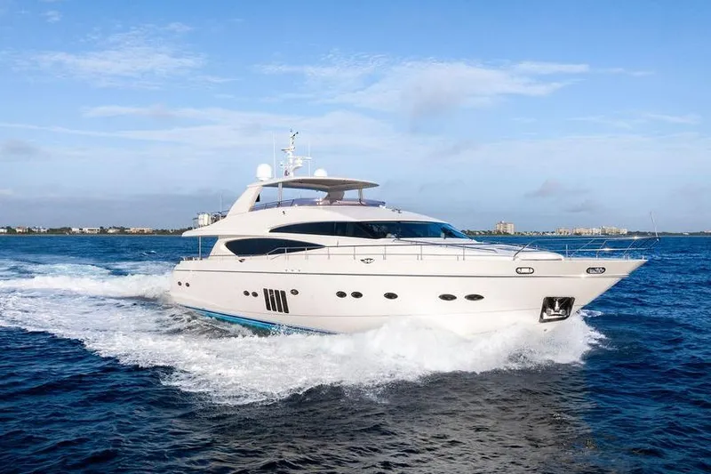 Slide: The Image of 2010 Princess 95 Motor Yacht cruising on open water under clear skies. - 16