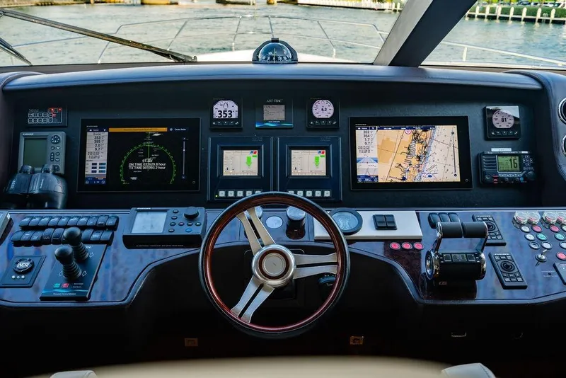 Slide: The Image of Control panel of a 2010 Princess 95 Motor Yacht with navigation screens and instruments. - 163