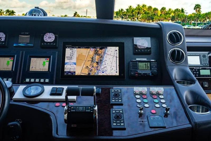 Slide: The Image of Control panel of a 2010 Princess 95 Motor Yacht with navigation screens and instruments. - 166