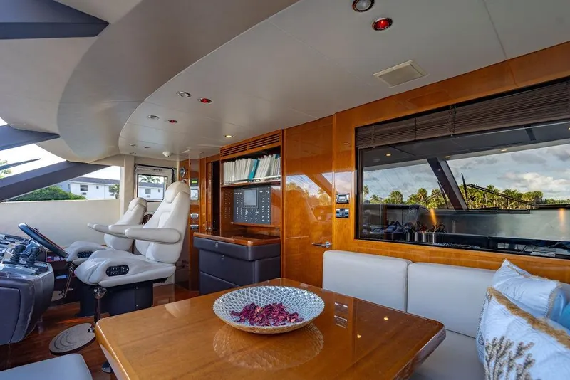 Slide: The Image of Luxurious interior of 2010 Princess 95 Motor Yacht with elegant seating and helm station. - 169