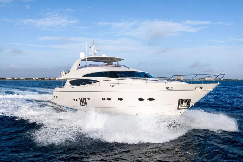 Slide: The Image of 2010 Princess 95 Motor Yacht cruising on open water under clear blue skies. - 17