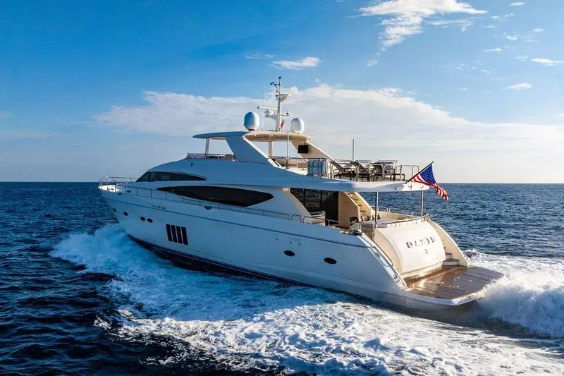 Slide: The Image of Luxurious 2010 Princess 95 Motor Yacht cruising on open sea under clear skies. - 27