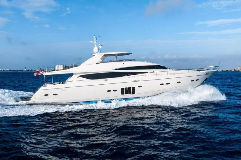 Slide: The Image of 2010 Princess 95 Motor Yacht cruising on open water under a clear blue sky. - 31