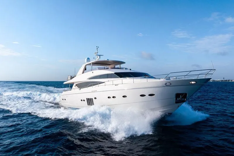 Slide: The Image of Luxurious 2010 Princess 95 Motor Yacht cruising on open sea under clear blue sky. - 32