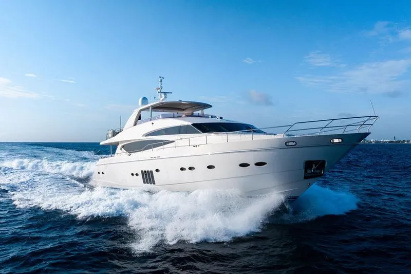 Slide: The Image of 2010 Princess 95 Motor Yacht cruising on open sea under clear blue sky. - 33