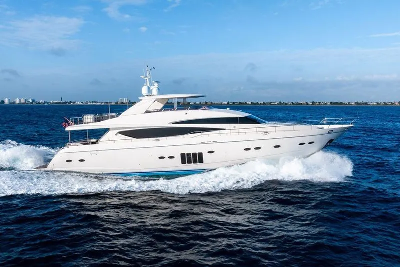 Slide: The Image of 2010 Princess 95 Motor Yacht cruising on open sea under clear blue sky. - 35