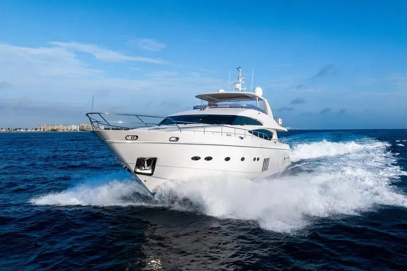 Slide: The Image of 2010 Princess 95 Motor Yacht cruising on open sea under clear blue sky. - 38