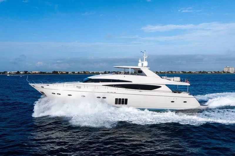 Slide: The Image of 2010 Princess 95 Motor Yacht cruising on open water under a clear blue sky. - 43