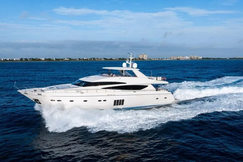 Slide: The Image of 2010 Princess 95 Motor Yacht cruising on open blue sea. - 44