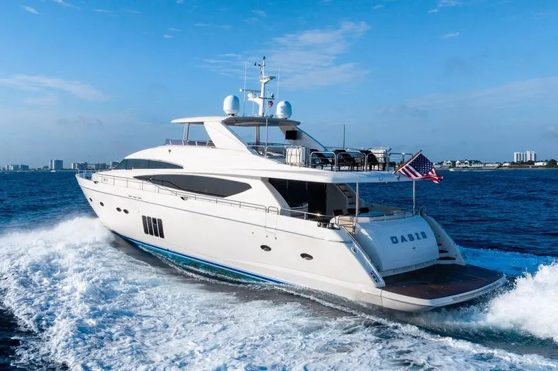 Slide: The Image of Luxury 2010 Princess 95 Motor Yacht cruising on open water, clear blue sky. - 47