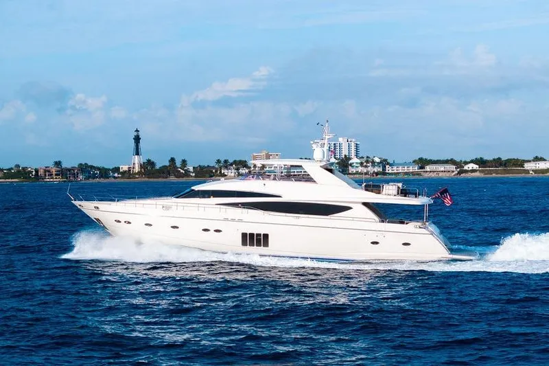 Slide: The Image of 2010 Princess 95 Motor Yacht cruising on blue ocean near coastal cityscape. - 52