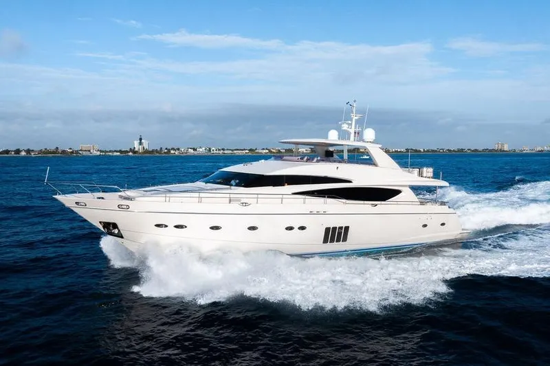 Slide: The Image of Luxurious 2010 Princess 95 Motor Yacht cruising on open sea under clear blue sky. - 55