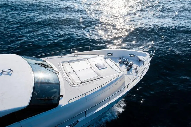 Slide: The Image of Luxurious 2010 Princess 95 Motor Yacht cruising on sparkling blue ocean waters. - 57