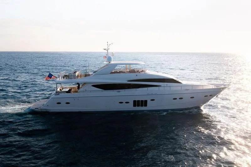 Slide: The Image of 2010 Princess 95 Motor Yacht cruising on open sea at sunset. - 58