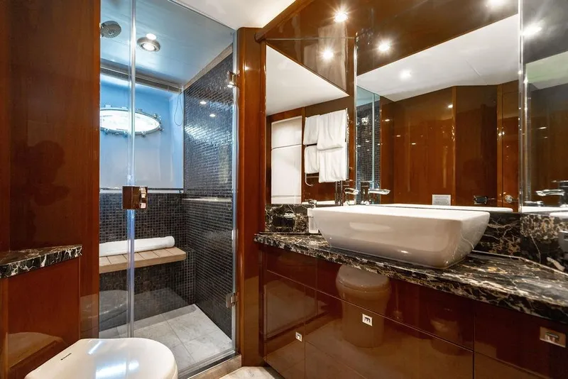 Slide: The Image of Luxurious bathroom on 2010 Princess 95 Motor Yacht with elegant fixtures and marble accents. - 64