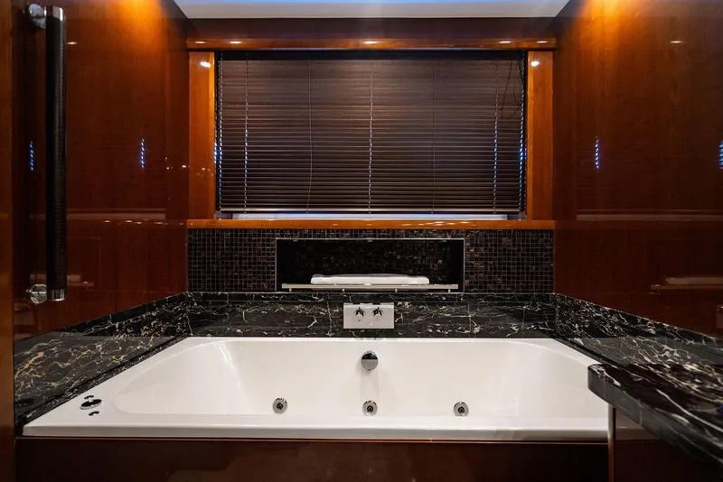 Slide: The Image of Luxurious bathroom with marble jacuzzi on 2010 Princess 95 Motor Yacht. - 85