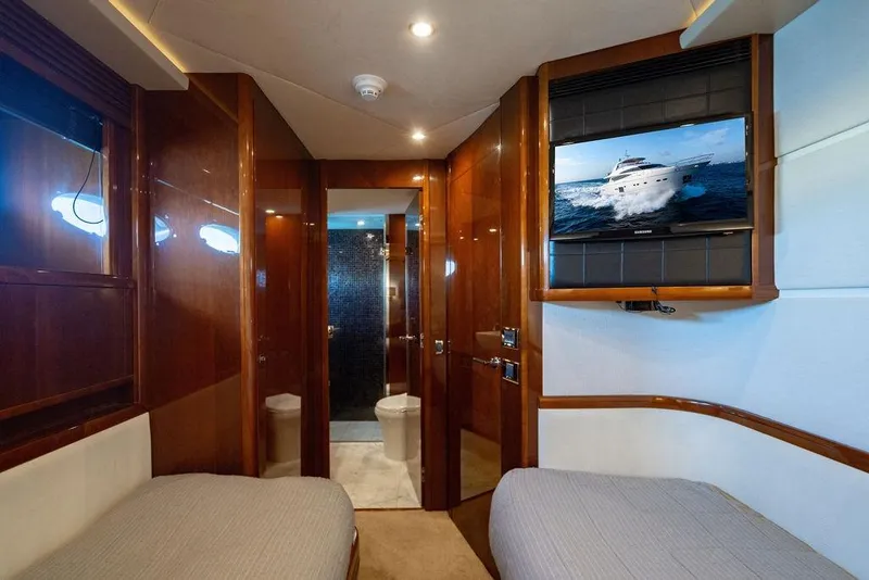 Slide: The Image of Luxurious interior of 2010 Princess 95 Motor Yacht with twin beds and TV. - 90
