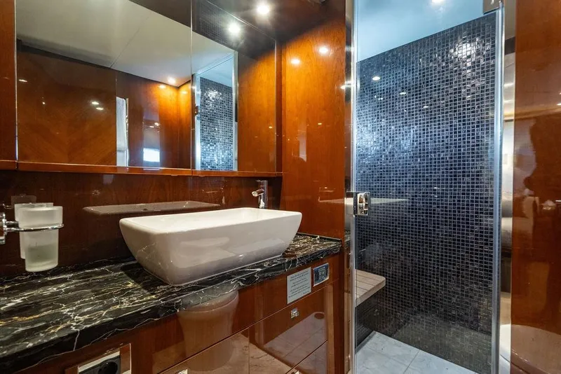 Slide: The Image of Luxurious bathroom on 2010 Princess 95 Motor Yacht with elegant sink and tiled shower. - 91