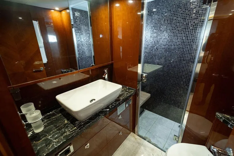 Slide: The Image of Luxurious bathroom in 2010 Princess 95 Motor Yacht with modern sink and glass shower. - 92