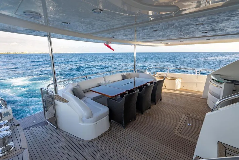 Slide: The Image of Luxurious deck of 2010 Princess 95 Motor Yacht with ocean view and elegant seating area. - 96