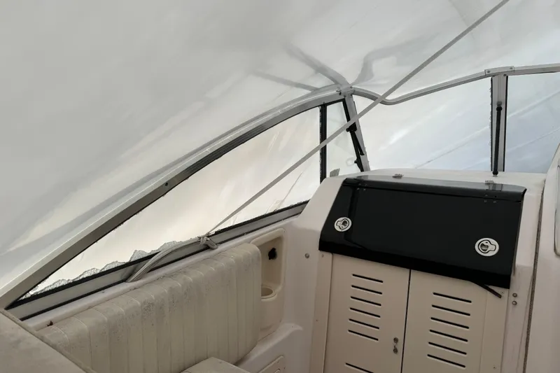 Slide: The Image of 2005 Grady-White Express 265 boat interior with seating and storage compartments. - 7