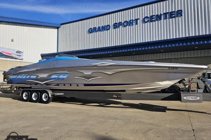 Slide: The Image of 2007 Hustler 41 Razor boat on trailer at Grand Sport Center. - 12