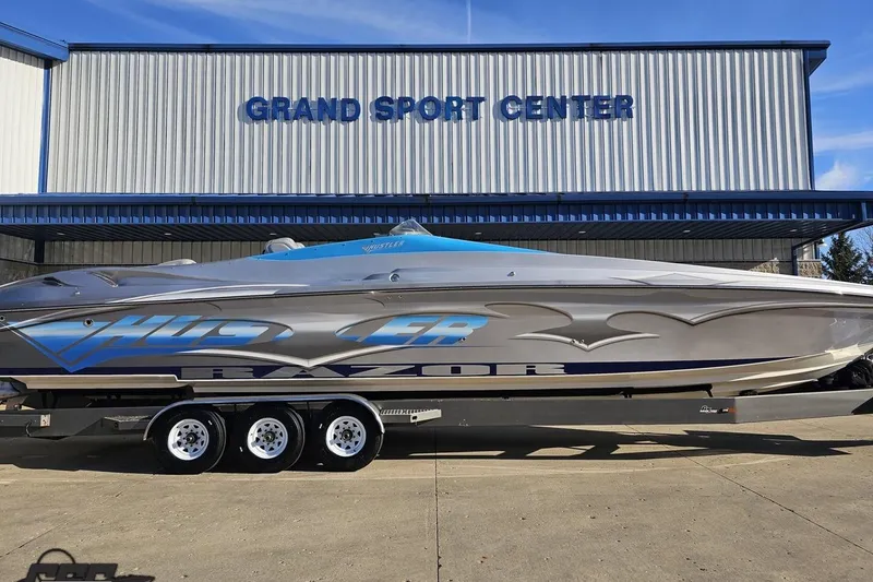 Slide: The Image of 2007 Hustler 41 Razor boat on trailer at Grand Sport Center. - 2