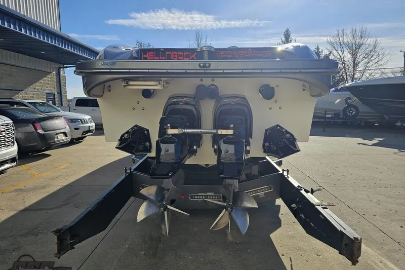 Slide: The Image of 2007 Hustler 41 Razor boat on trailer, rear view showing dual propellers. - 30