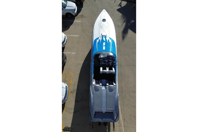 Slide: The Image of Aerial view of 2007 Hustler 41 Razor speedboat with blue and white design. - 35