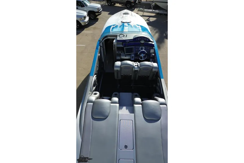 Slide: The Image of 2007 Hustler 41 Razor boat interior with blue and gray seating and dashboard. - 36
