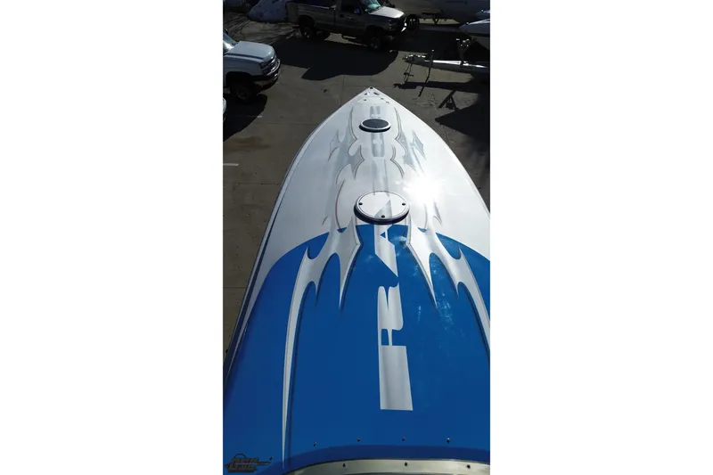 Slide: The Image of Top view of 2007 Hustler 41 Razor boat with blue and white design. - 38