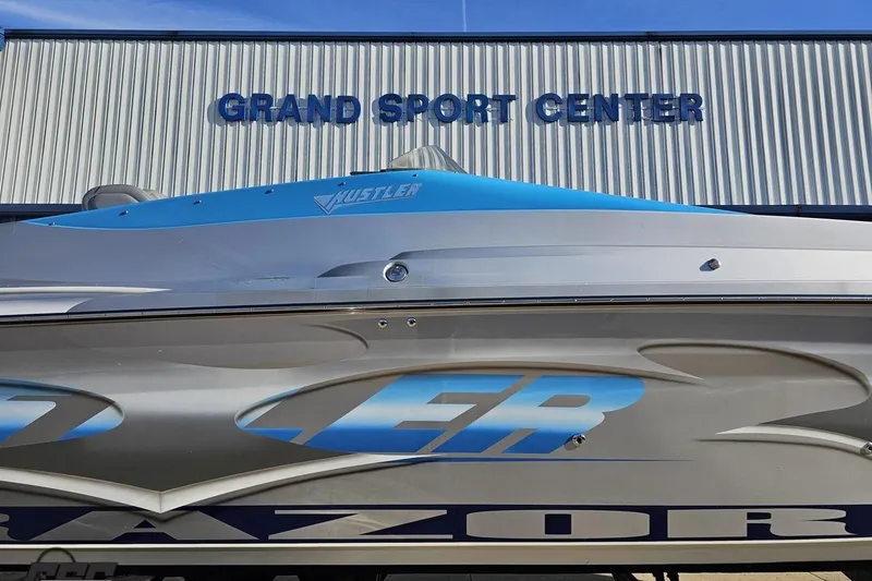 Slide: The Image of 2007 Hustler 41 Razor boat at Grand Sport Center, showcasing sleek design. - 4