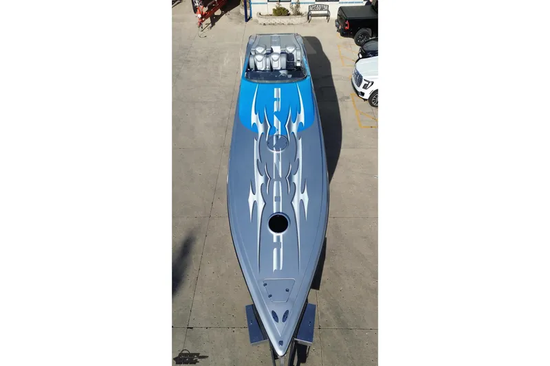 Slide: The Image of 2007 Hustler 41 Razor speedboat with blue and gray flame design, aerial view. - 40
