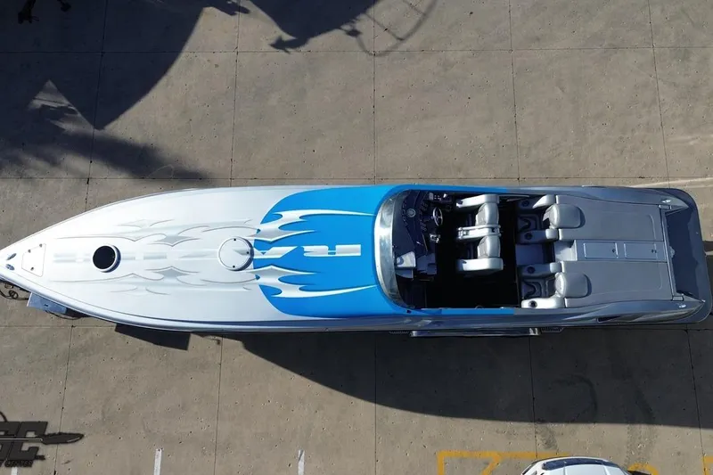 Slide: The Image of Aerial view of 2007 Hustler 41 Razor speedboat with blue and white design. - 45