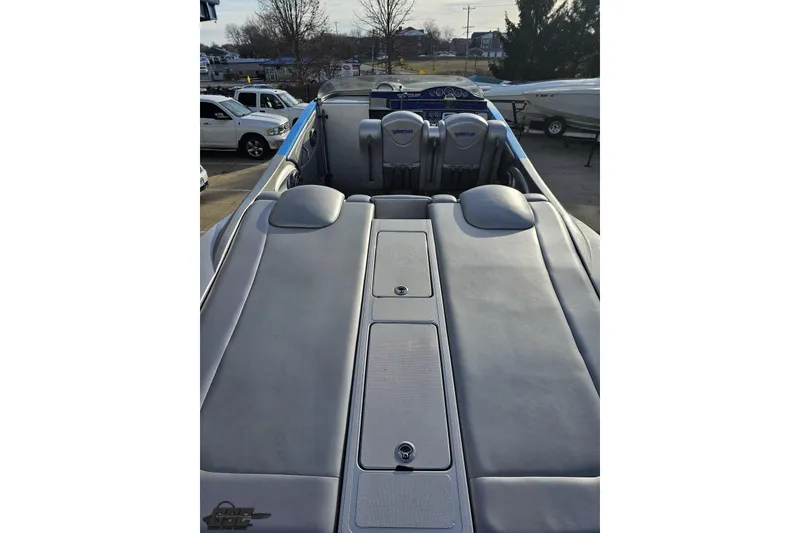 Slide: The Image of 2007 Hustler 41 Razor boat interior with gray seating and dashboard view. - 47