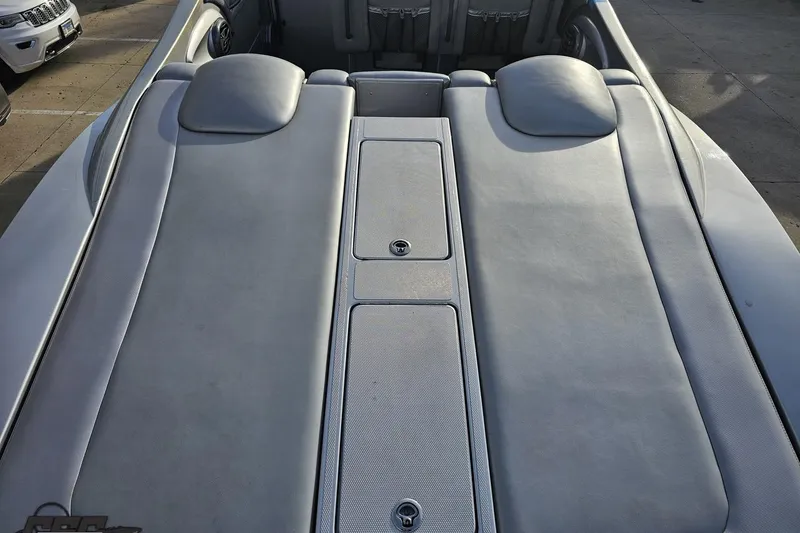 Slide: The Image of 2007 Hustler 41 Razor boat interior with cushioned seating and storage compartments. - 48