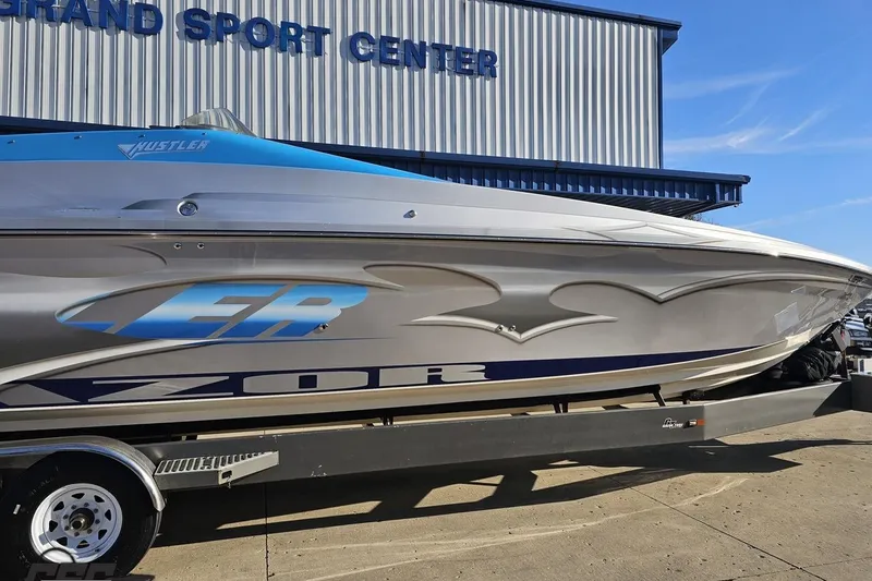 Slide: The Image of 2007 Hustler 41 Razor boat at Grand Sport Center, side view. - 5