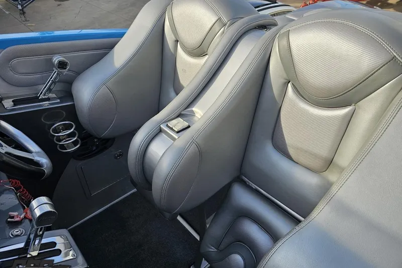 Slide: The Image of 2007 Hustler 41 Razor interior with sleek gray leather seats and modern controls. - 59