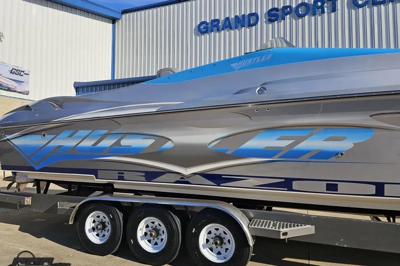 Slide: The Image of 2007 Hustler 41 Razor boat on trailer at Grand Sport Center. - 7