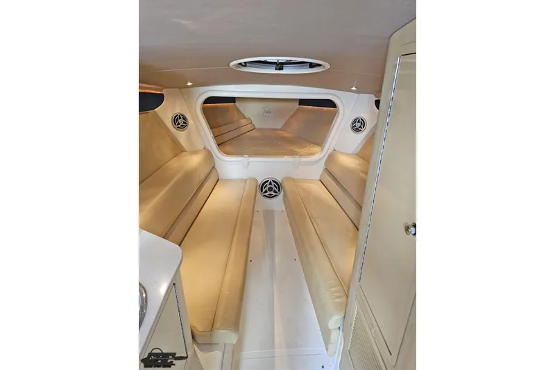 Slide: The Image of Interior of 2007 Hustler 41 Razor boat with beige seating and modern design. - 77